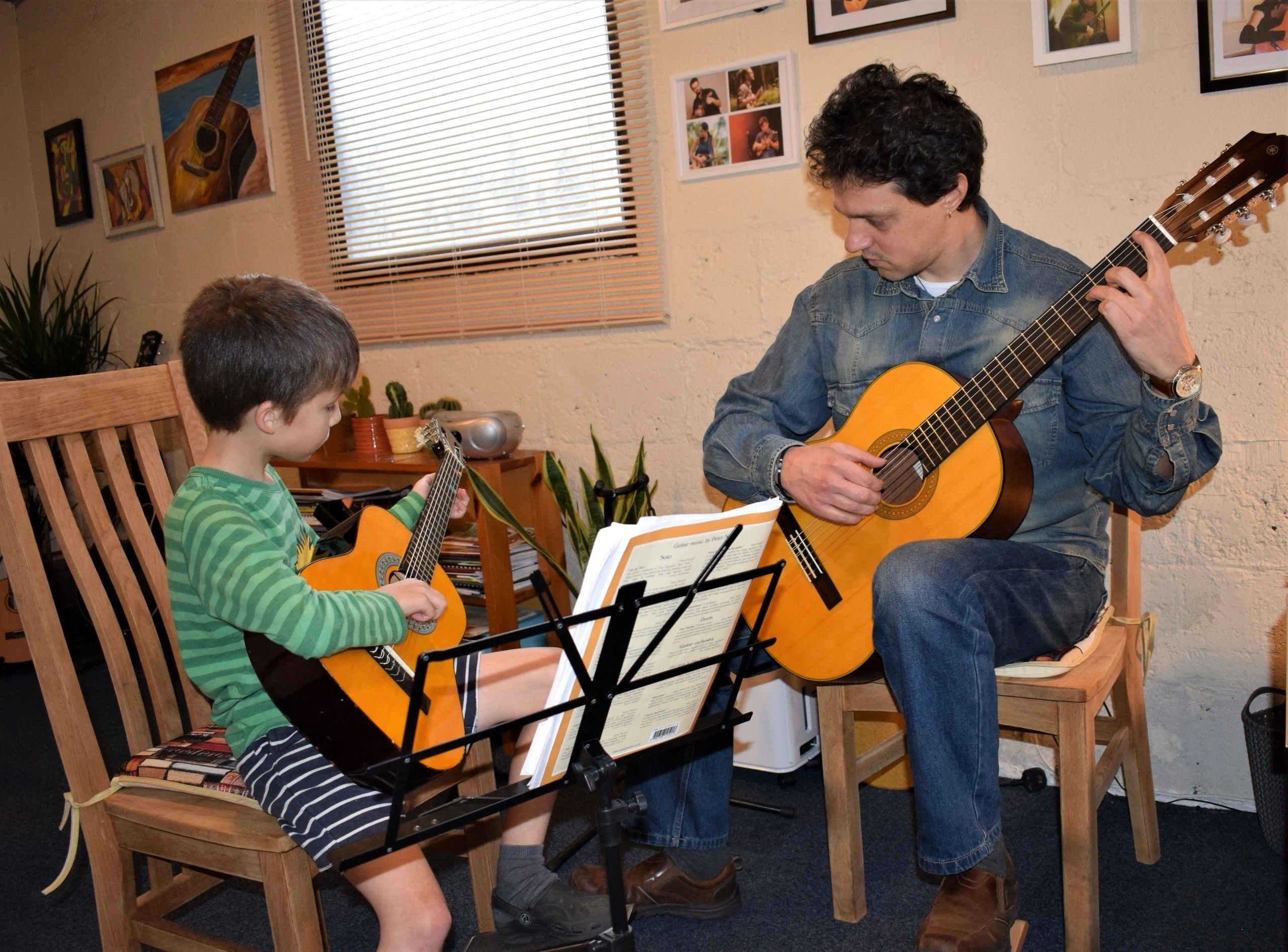 Martin teaching a young guitar student in his studio